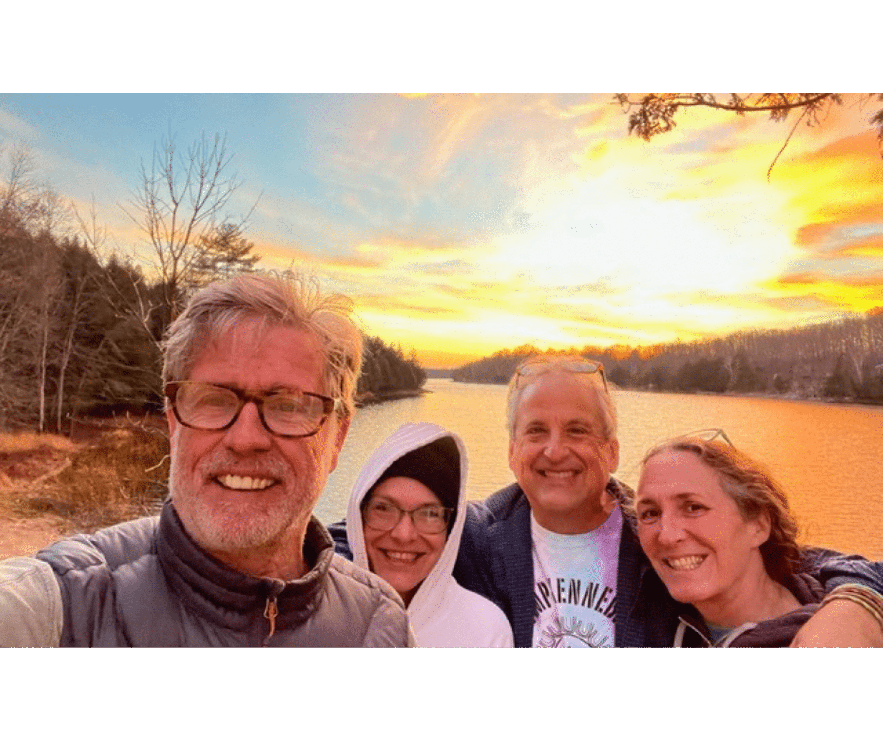 Brian with Holly, Jay and Donz posing with sunset